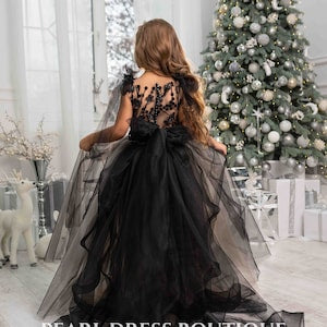 Black lace bodice tulle skirt flower girl dress, back view with full gathered tulle