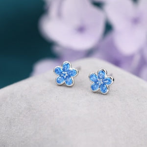 Sterling silver blue flower CZ stud earrings, four-petal floral design