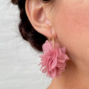 Gold hoop earrings with pink fabric puff flower detail