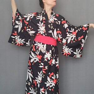 Black floral print kimono with wide sleeves and tied waist belt