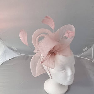 Pale pink feather fascinator hatinator with soft bow and attached clip
