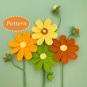 Crochet flower bouquet pattern with yellow, orange, and green flowers and white centers on stems