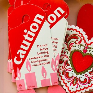 Decorative candle caution label cards with red heart tags and flame warning text