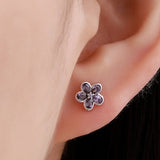 Amethyst purple CZ flower stud earrings in silver tone, small forget-me-not style