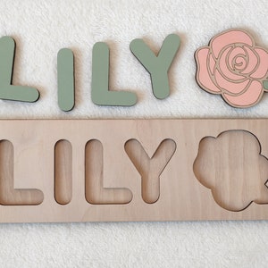 Wooden name puzzle with cutout letters "LILY" and a rose flower detail