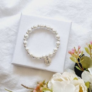 White pearl flower girl bracelet with round beads and small heart charm