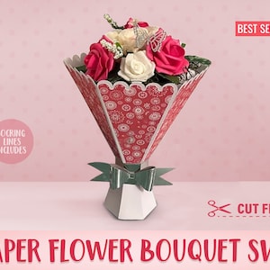 Paper flower bouquet in red patterned wrap with white and pink blooms, tied ribbon and vase