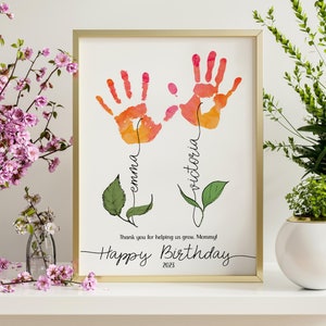 Framed birthday keepsake print with colorful handprints and leaf accents for Mom
