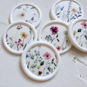 White round watercolor floral wax seals with botanical designs
