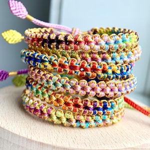 Hand-woven braided flower bracelet in multicolor pastel crochet weave stack