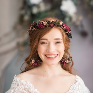 Floral half wreath headband with dark pink and burgundy flowers and leafy accents