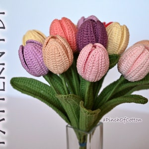 Crochet tulip bouquet with pink, purple, beige flowers and green leaves