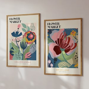 Set of framed floral art prints with colorful flower designs and market-style typography