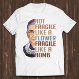 White t-shirt with portrait and stacked text: NOT FRAGILE LIKE A FLOWER BOMB