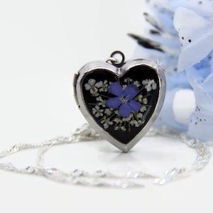 Heart-shaped flower locket necklace with silver chain, clear front with pressed blooms