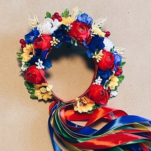 Floral wreath headband with blue and red flowers and multicolor ribbon ends