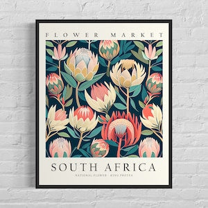 Framed botanical art print with pastel pink and cream flowers; text “SOUTH AFRICA”