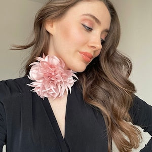 Pink floral choker necklace with a large layered flower centerpiece