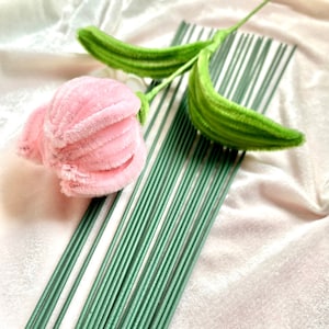 Craft flower stem with pink fabric bloom and green floral wire