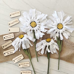 White rag tie flowers with yellow centers and small gift tags for DIY Mother's Day