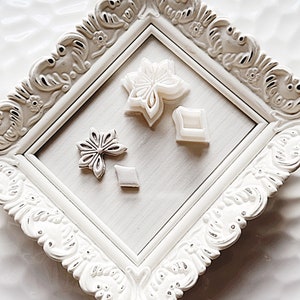 Star-shaped pointed flower cookie cutters with four embossed clay pieces, set of cutters