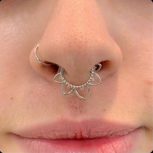 Silver hinged septum hoop with dangling flower charm for nose piercing