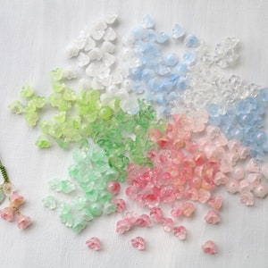 Set of glass bell flower beads, assorted white, light blue, green and pink, 20 pcs