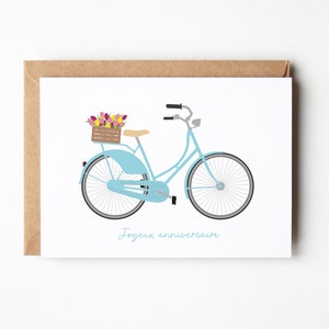 Birthday card with blue bicycle illustration and small bouquet of flowers