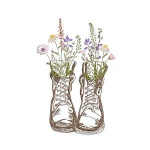 Botanical flower boot embroidery design: two white boots with wildflower artwork.