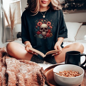 Black T-shirt with colorful floral skull graphic on the front