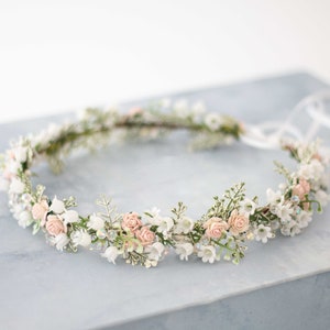Floral head wreath with pale pink and white blossoms and greenery, soft loop band
