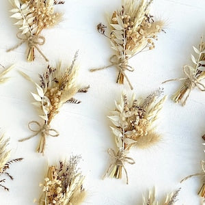 Mini dried flower bouquets tied with twine, beige and cream blooms