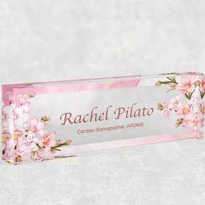 Clear acrylic desk name plate with floral border and custom name Rachel Pilato