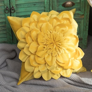 Yellow velvet peony flower pillow cover with layered petals, on gray cushion