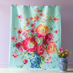 Floral quilt with colorful vase embroidery and multicolor square stitching