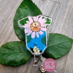 Floral pressed flower badge reel with hexagonal clear cover and metal clip