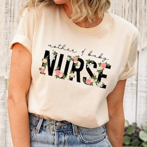 Cream nurse t-shirt with floral NURSE lettering and mother & baby graphic
