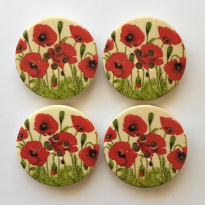 Set of four round red flower poppy buttons with green leaves and center design