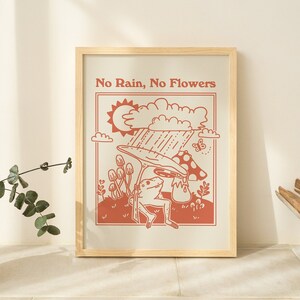 Framed burnt orange frog quote wall art with text 'No Rain, No Flowers'