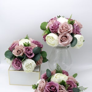 Dusty mauve and ivory silk floral wedding centerpiece in white vase with roses and greenery