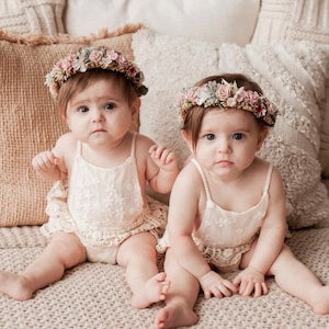 Baby flower crown with dusty rose and mauve blossoms on small infants' heads