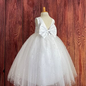 White tulle flower girl dress with large bow, ankle-length, V-back