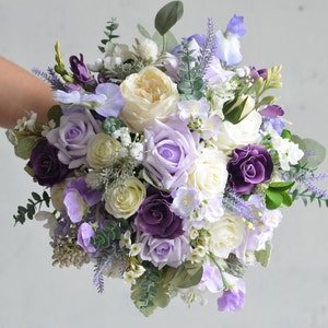 Lilac and purple faux rose bridal bouquet with lavender blooms and greenery