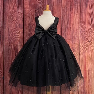 Black tulle flower girl dress with V-back neckline and large bow at back