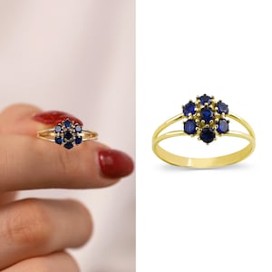 14k gold ring with blue hexagon flower sapphire cluster centerpiece and petal stones