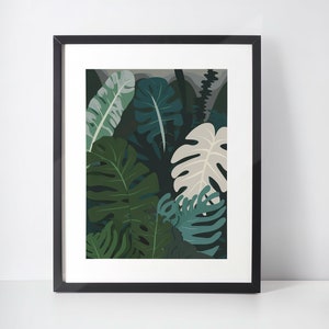 Framed boho leaf art print with green monstera-style foliage on light background