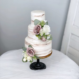 Set of 2 floral cake toppers with mauve and white flowers on black holders