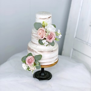 Dusty pink rose floral cake topper with greenery and small white blooms