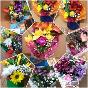 Assorted wrapped flower bouquets in letterbox gift boxes