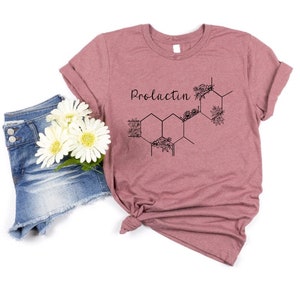 Pink T-shirt with Prolactin text and atom graphic design, crew neck short sleeves